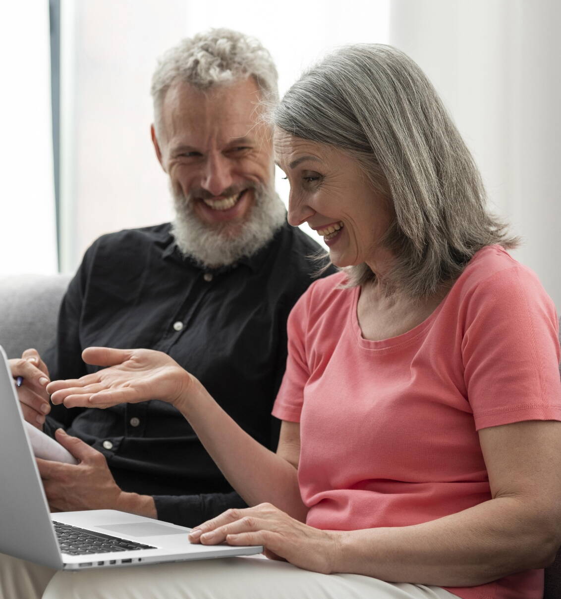 older-couple-home-couch-using-laptop.jpg